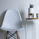 round white and brown wooden table near chair