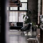 three assorted-color throw pillows on black leather couch