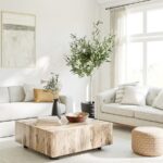 a living room filled with furniture and a large window